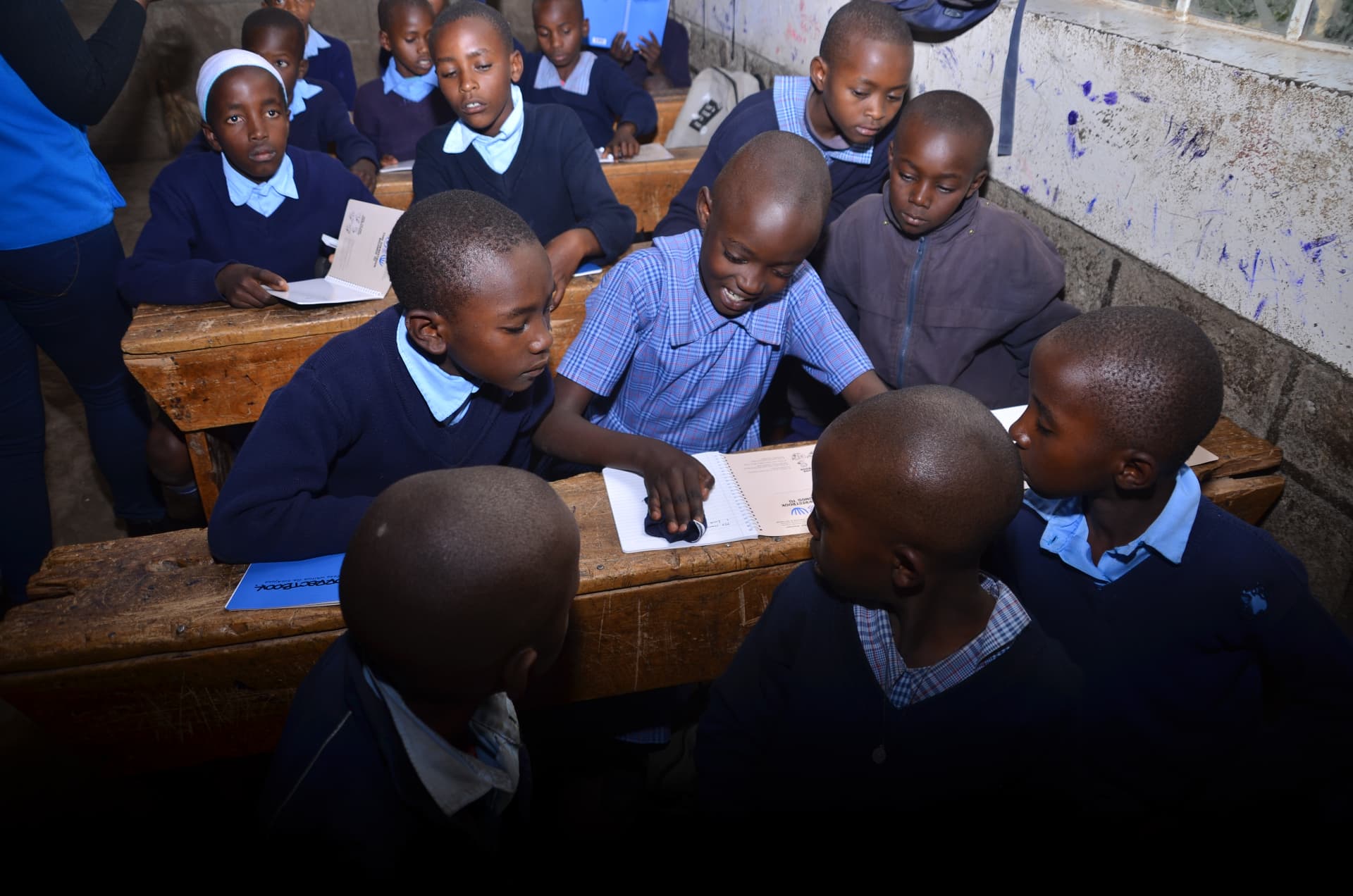 Learners using Correctbook materials together in a classroom